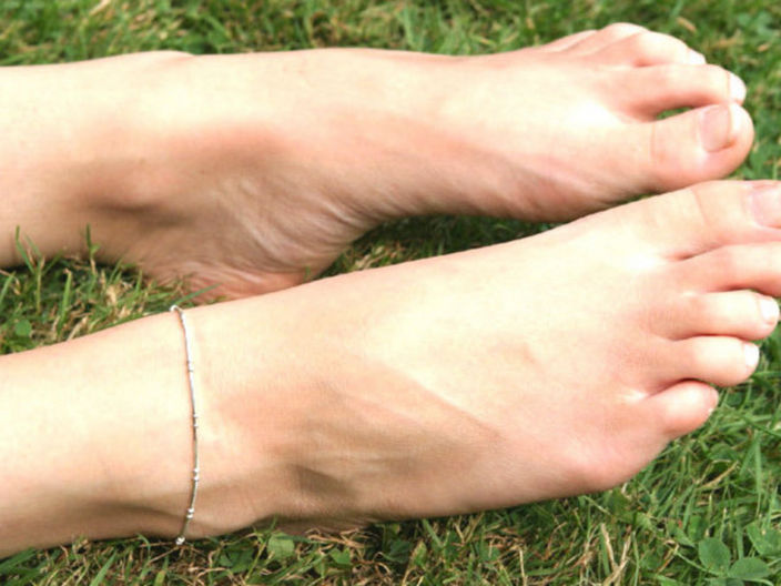 Tickling pantyhosed foot