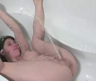woman peeing in the shower